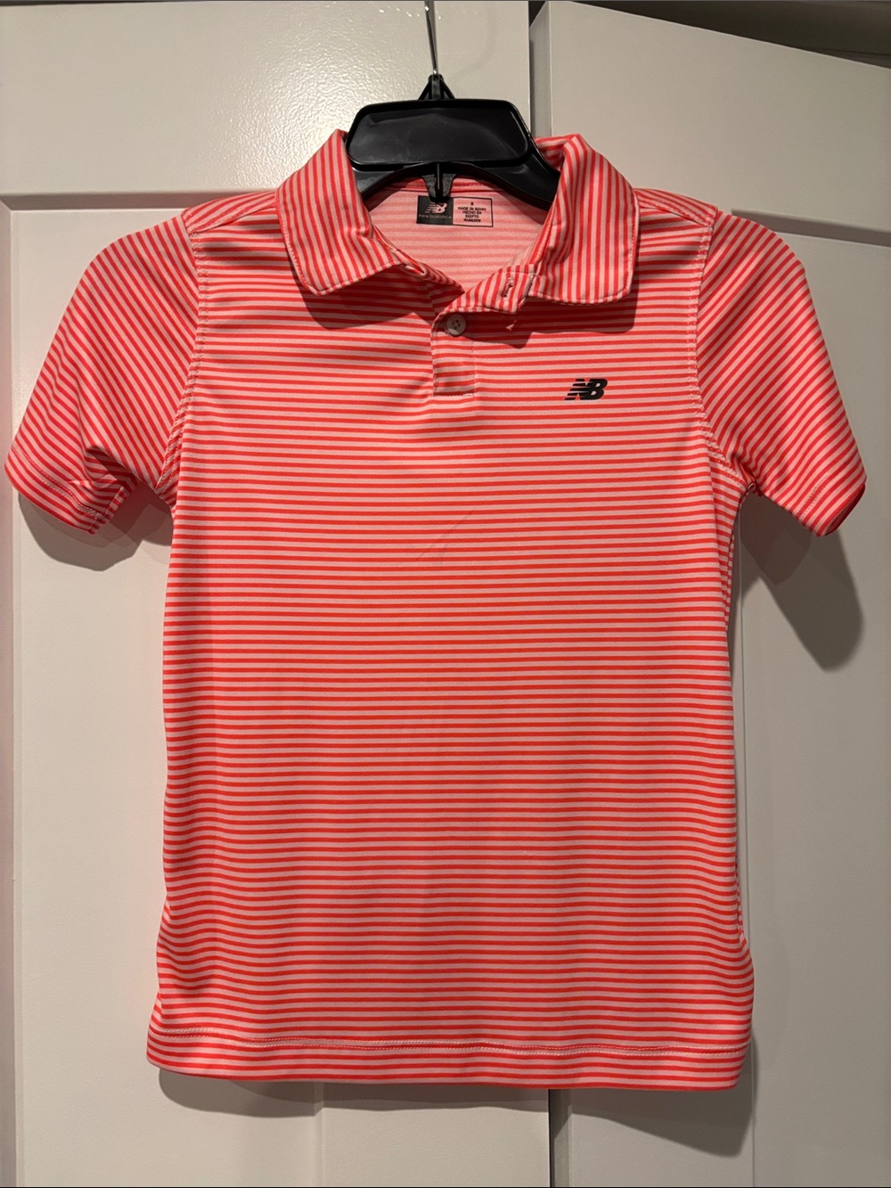 New Balance Orange and White Striped boys Polo